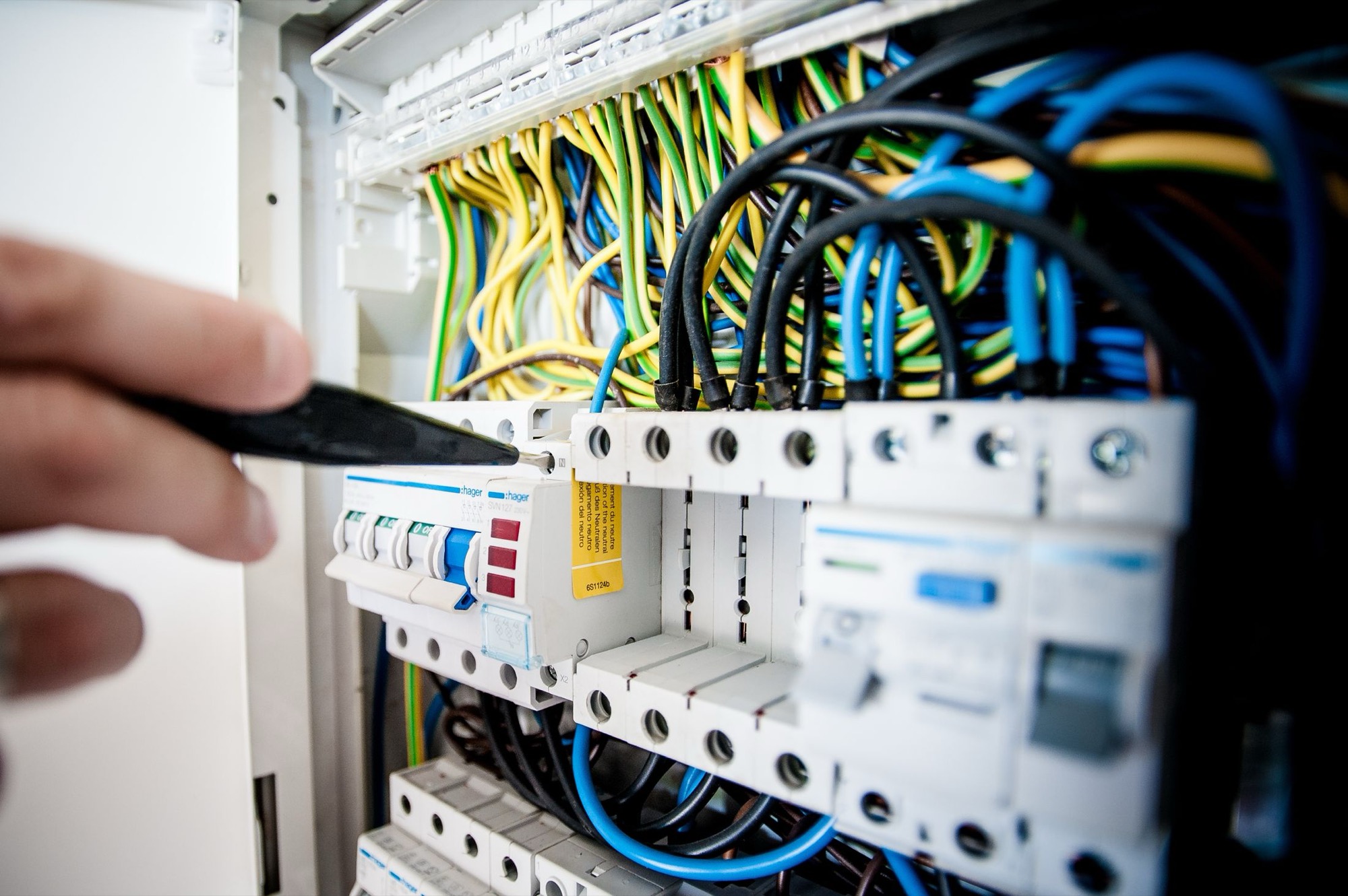 A consumer unit with RCD and MCB protection, colour-coded cabling landed and labelled